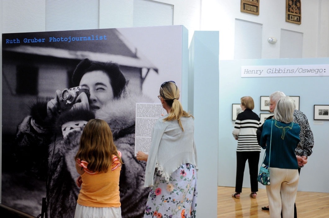 Visitors exploring an exhibition at the Jewish Museum of Florida